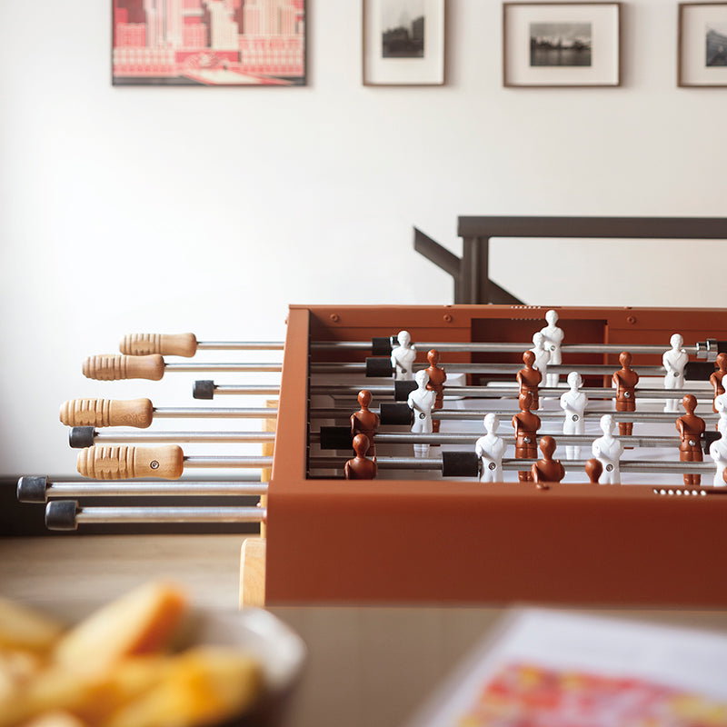 White and terracotta RS Barcelona table football players.